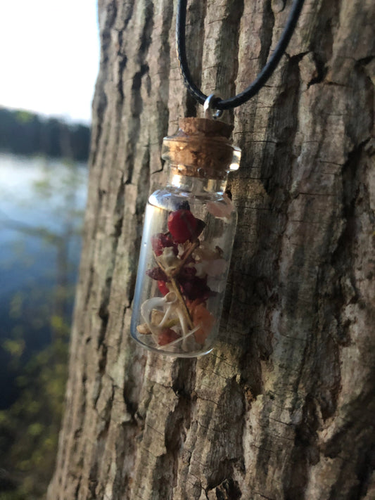 Rodent Bone And Flower Bottle Charm Necklace