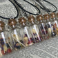 Rodent Bone And Flower Bottle Charm Necklace