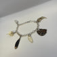 Oddity Charm Bracelet with Rodent Mandible, Butterfly Wings, Python Vertebra, and Seashell