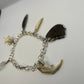 Oddity Charm Bracelet with Rodent Mandible, Butterfly Wings, Python Vertebra, and Seashell